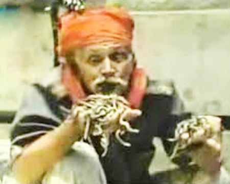 Man eating live Cobra snakes like noodles in Bangladesh - Believe It or Not