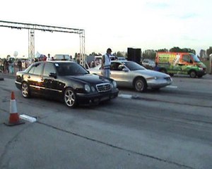 Mercedes E55 AMG Vs. Lincoln Mark VIII Drag Race