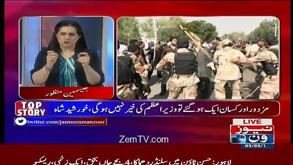 Jasmeen Manzoor plays a video of Rangers person with a pistol in his hand during protest
