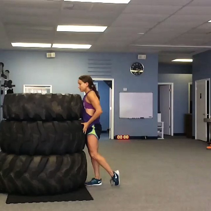 Girl Jumps on Top of Giant Tires