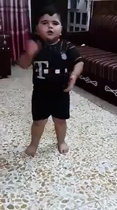 A fat boy dancing and singing......