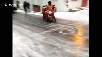 Motortricycle loses control on icy road