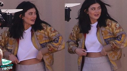Kylie Jenner Flashes her Toned Tummy as She Awkwardly Adjusts Crop Top