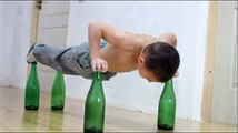 Kid Does Push Ups On Glass Bottles - Funny Videos at Videobash