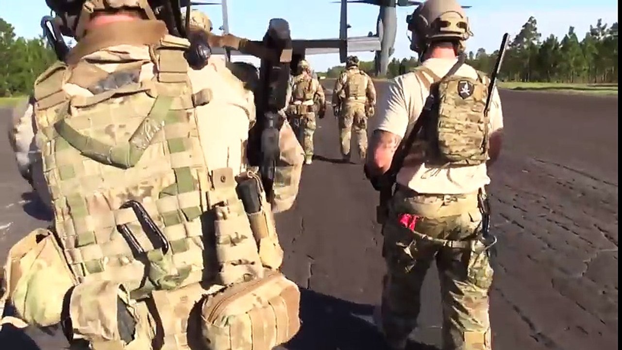 US Special Operation Fighters During Fast Roping From V-22 Helicopter