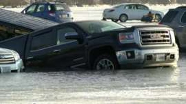 Vehicles sink as frozen US 'car park' unexpectedly melts