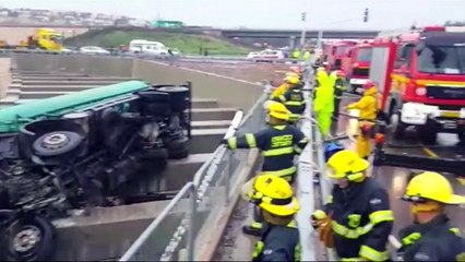 Boy left hanging upside down from a bridge after truck crash