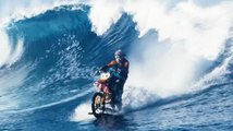 Crazy scene: Biker surfing giant wave with his motorbike