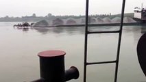 Unbalanced Boat carrying gravel SINKS in a river in China