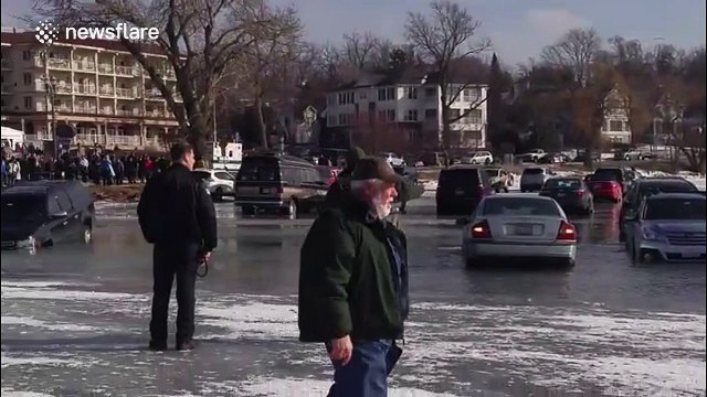 Cars parked on ice near Chicago start to sink as it melts