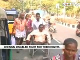 In wheelchairs, crutches, for rights they stand up