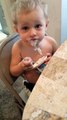 2 Yr. Old Child Trying to Eat Pudding and Enjoying Eating it So Much He Wears Most of It!