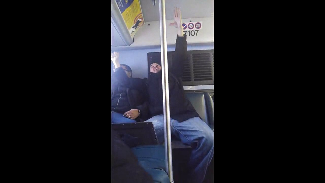 Drunk guy on bus loves Eddie Murphy, harasses passenger, gets pulled off by police