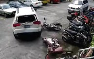 Woman Driver Destroys Parked Motorcycles and Cars