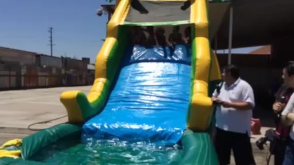 Girls on the slide at bike wash