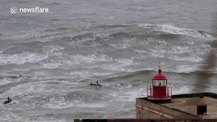 Australian surfer rides monster waves during storm