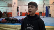 In Syria's Aleppo city, young boys box to drown out bombs