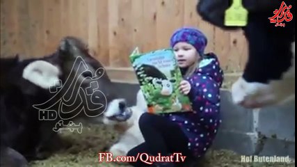 A child tells a bedtime story to her friend