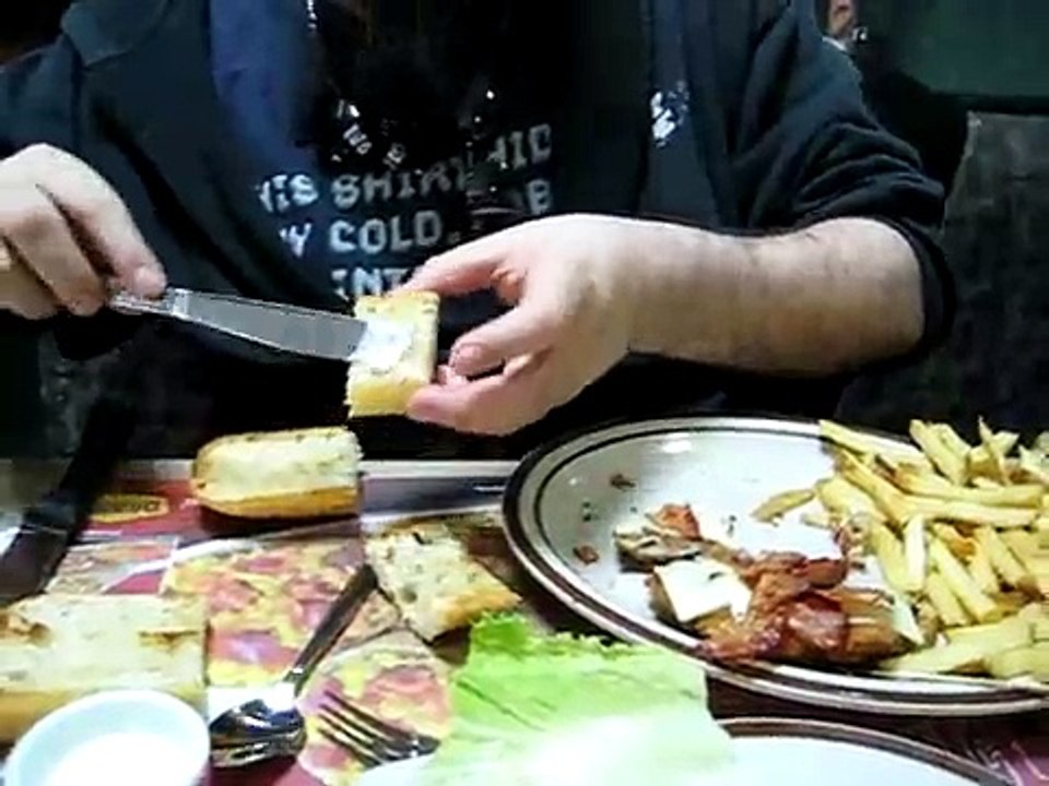 Katsu eats a sandwich