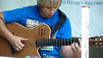 Flintstones music theme on harmonica and acoustic guitar at Grushinskiy fest, Russia 2010