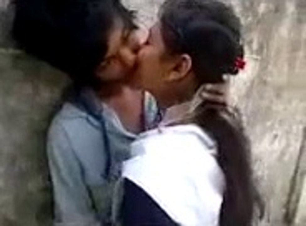 boy kissing girl in classroom
