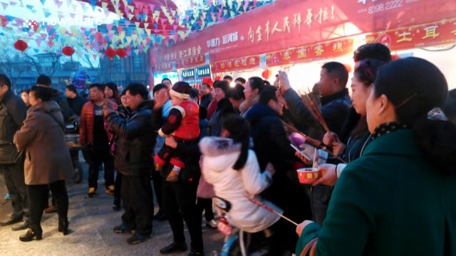 Energetic food stall staff dress up as Chinese novel characters and dance wildly