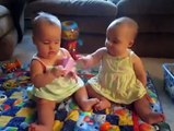 Funny Babies -- Twins fighting over cell