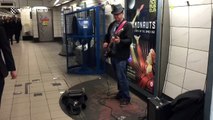 Amazing busker covers Sultans of Swing at Bank Station, London