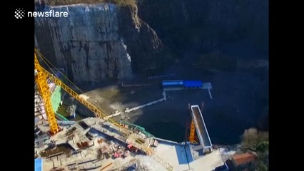 Aerial footage of Chinese hotel being built in a giant hole in the ground