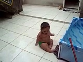 cute weird baby slides around on tiles