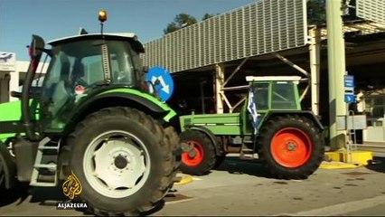 Greek farmers protest over austerity plans