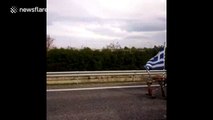 Travellers walk as Athens airport road blocked by protesting farmers