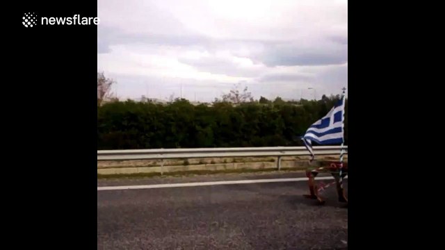 Travellers walk as Athens airport road blocked by protesting farmers