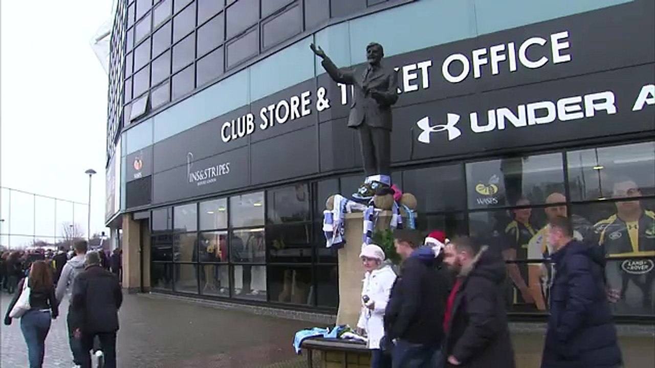 Jimmy Hill's statue adorned with scarves as fans pay tribute