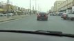 black Chevrolet drifting while police on the road