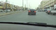 black Chevrolet drifting while police on the road