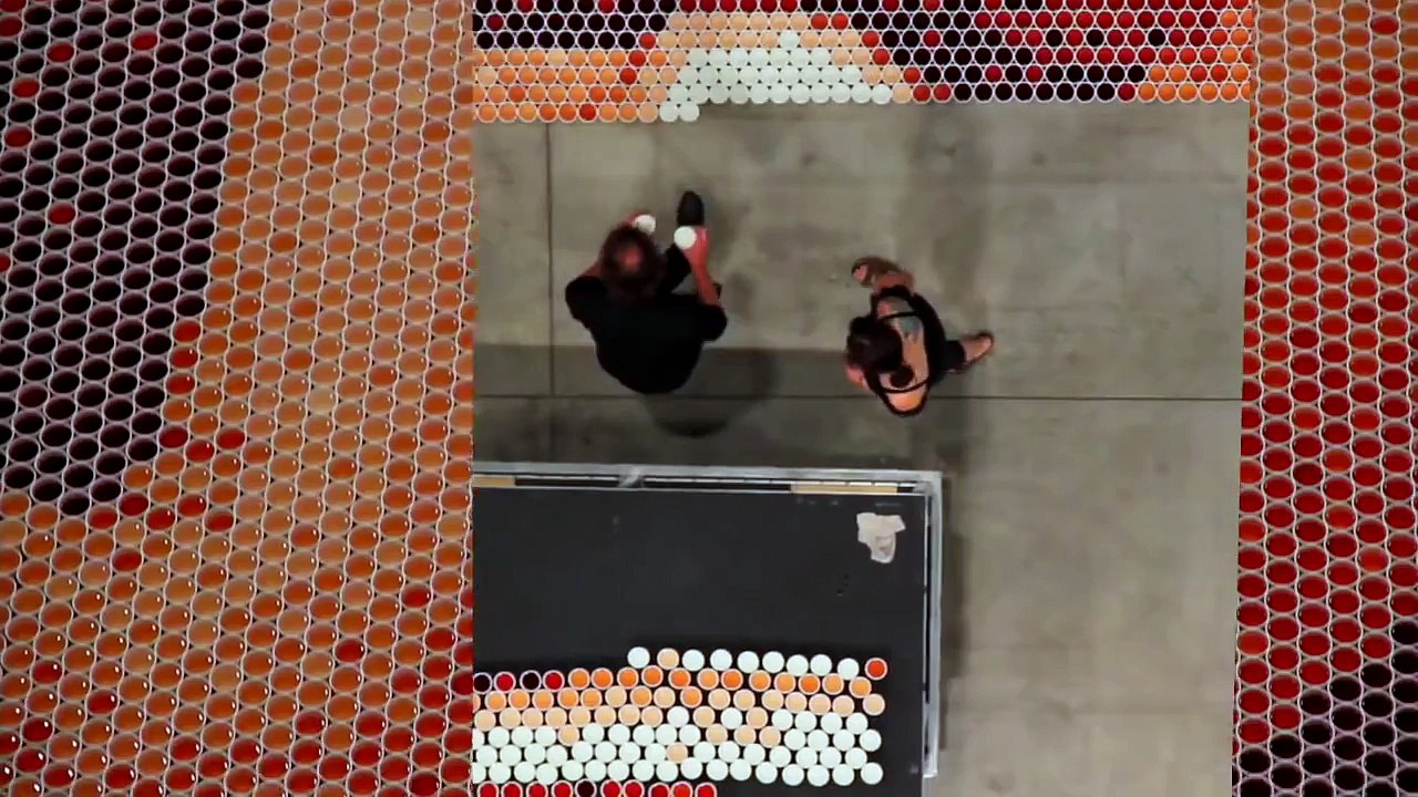 He positioned 66000 cups full of water. When the camera zooms out everyone is blown away.