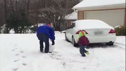 FOOTAGE : Dad Throws Giant Snowball at Kid
