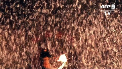Chinese blacksmiths make molten metal sparks fly for New Year