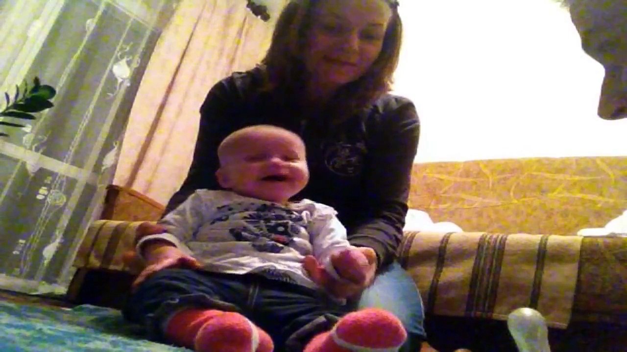 Baby hysterically laughs at coughing dad