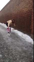 Girl Struggles to Walk on Ice