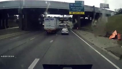 RAW: Truck crashes, rolls over on I 75 in Detroit after car cuts in front and hits the veh