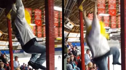 Flamboyant Hockey Fan Drunkenly Swings From Railing, Falls On Unsuspecting Woman