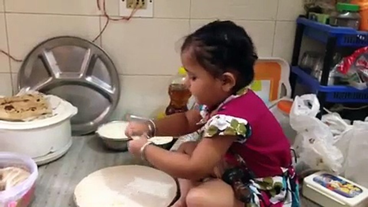 Cute little girl making bread