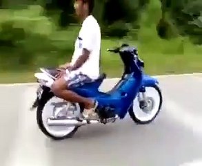 Crazy guy driving motorbike on the road