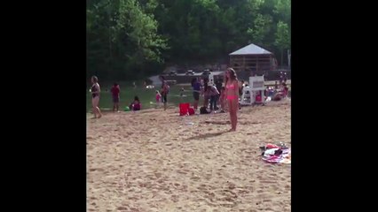 Girl Fails Cartwheel and Face Plants Into Sand