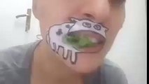 a woman with cow tatto on his face eating grass.. very funny must watch ..