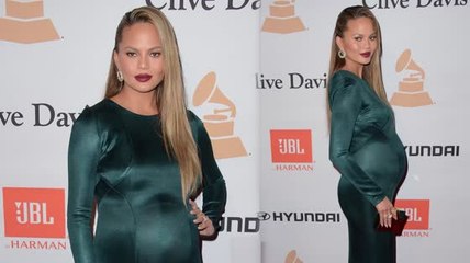 Chrissy Teigen Shows Baby Bump in Form Fitting Dress