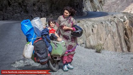 A Brave Pakistani Couple Traveling in Northern Pakistan on Bike..