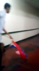 A student using the PH Flag as a mop